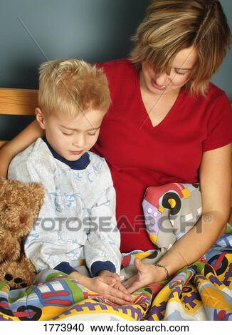 Praying parent and son View Large Photo Image Stock Image - Praying parent and son. Fotosearch