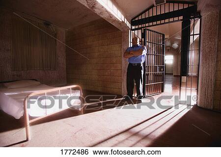 Prison security guard and cell View Large Photo Image Stock Photograph - Prison security guard and cell. Fotosearch