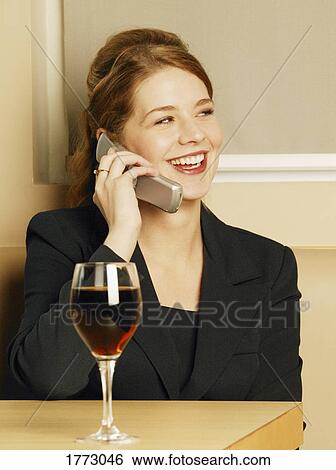 Stock Photograph - Professional woman on cell phone. Fotosearch