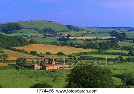 Rolling green countryside View Large Photo Image Stock Photograph - Rolling green countryside. Fotosearch