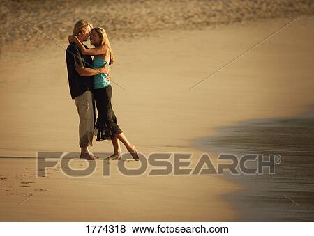 Stock Photo - Romantic couple on the beach. Fotosearch