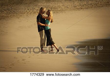 Romantic stroll along the beach View Large Photo Image Stock Photo - Romantic stroll along the beach. Fotosearch