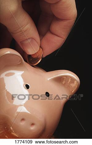Stock Photo - Saving the pennies. Fotosearch