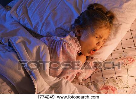 Sick child in bed View Large Photo Image Stock Photo - Sick child in bed. Fotosearch
