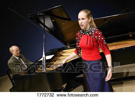 Singer accompanied by piano View Large Photo Image Stock Image - Singer accompanied by piano. Fotosearch