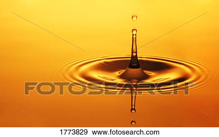 Stock Photo - Split second drop of liquid. Fotosearch