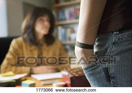 Student in professor's study View Large Photo Image Stock Photograph - Student in professor's study. Fotosearch