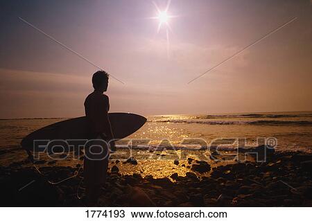 Surfer at the end of the day View Large Photo Image Stock Image - Surfer at the end of the day. Fotosearch