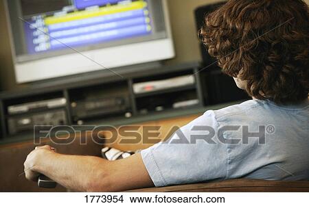 Picture - Teen watching TV. Fotosearch