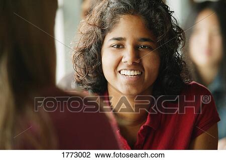 Teenage female chatting with friend View Large Photo Image Stock Image - Teenage female chatting with friend. Fotosearch