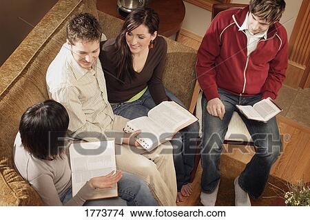 Teenagers having discussion about bible View Large Photo Image Picture - Teenagers having discussion about bible. Fotosearch