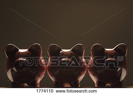 Stock Image - Three pottery pigs. Fotosearch