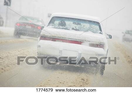 Traffic on slushy road View Large Photo Image Stock Photo - Traffic on slushy road. Fotosearch
