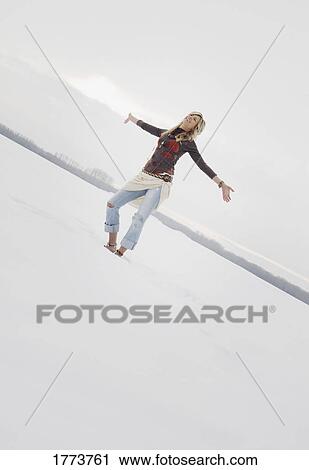 Stock Image - Woman in snow. Fotosearch