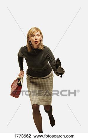 Woman rushing around View Large Photo Image Stock Image - Woman rushing around. Fotosearch