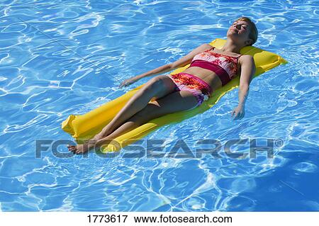 Woman sun tanning View Large Photo Image Stock Photo - Woman sun tanning. Fotosearch