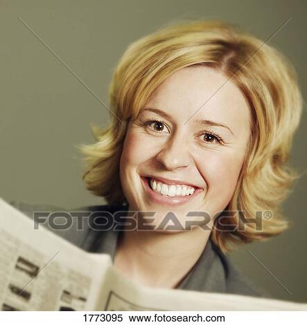 Woman with a newspaper View Large Photo Image Stock Photography - Woman with a newspaper. Fotosearch