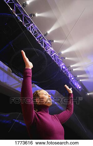 Stock Photograph - Woman worshiping. Fotosearch