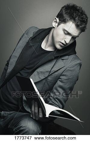 Young man reading View Large Photo Image Stock Photo - Young man reading. Fotosearch