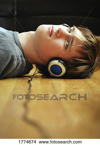 Young man with headphones View Large Photo Image Picture - Young man with headphones. Fotosearch