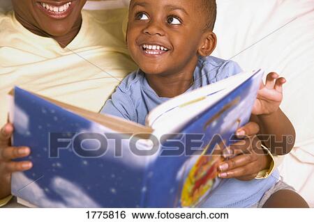 A bedtime story with mommy View Large Photo Image Stock Photograph - A bedtime story with mommy. Fotosearch