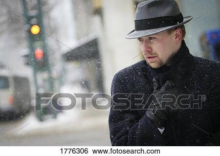 Stock Photograph - A businessman feels the cold. Fotosearch