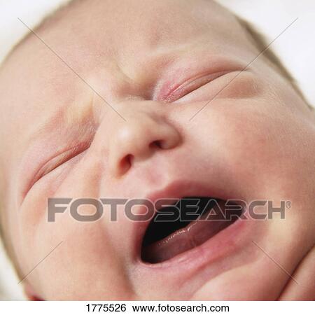 Stock Photograph - A crying baby. Fotosearch