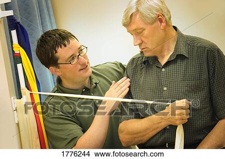 Picture - A physiotherapist working with a patient. Fotosearch