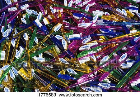 Stock Photo - A pile of new toothbrushes. Fotosearch