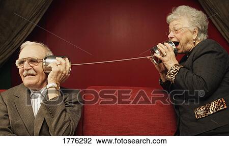 A senior couple trying to communicate View Large Photo Image Stock Image - A senior couple trying to communicate. Fotosearch