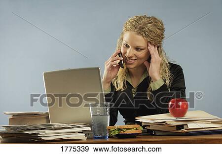 Stock Photo - A working lunch. Fotosearch