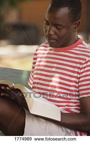 African American man reading View Large Photo Image Stock Photo - African American man reading. Fotosearch