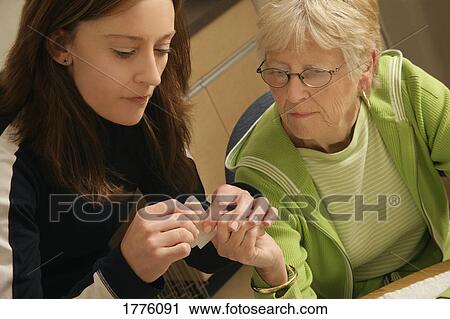 Stock Image - Bandage over woman's finger. Fotosearch