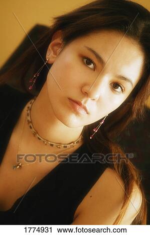 Stock Image - Beautiful serious woman. Fotosearch