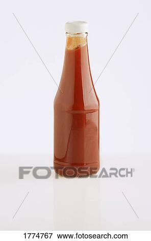 Bottle of tomato ketchup against a white background View Large Photo Image Stock Photo - Bottle of tomato ketchup against a white background. Fotosearch