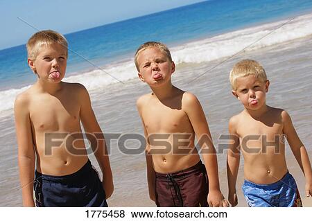Brothers sticking out their tongues View Large Photo Image Stock Photo - Brothers sticking out their tongues. Fotosearch