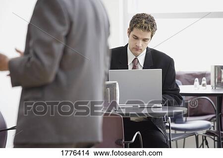 Businessman at laptop View Large Photo Image Picture - Businessman at laptop. Fotosearch