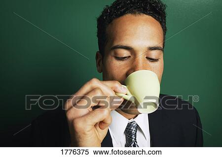 Stock Photography - Businessman drinking coffee. Fotosearch