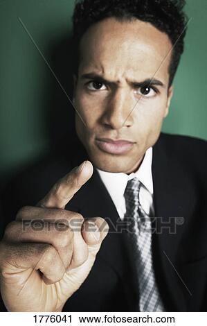 Stock Image - Businessman making a point. Fotosearch