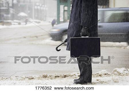 Businessman out in the cold View Large Photo Image Stock Image - Businessman out in the cold. Fotosearch