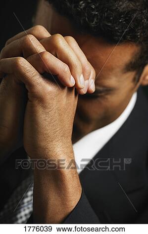 Businessman praying View Large Photo Image Stock Photo - Businessman praying. Fotosearch