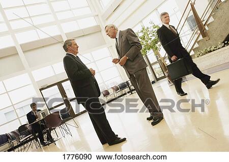 Businessmen discussing View Large Photo Image Stock Image - Businessmen discussing. Fotosearch