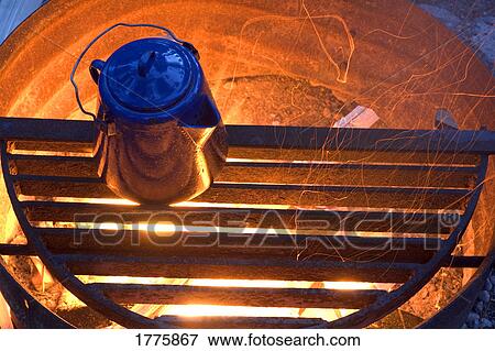Stock Photo - camping kettle over fire. Fotosearch