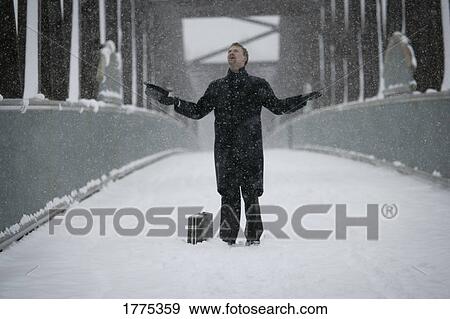 Stock Photo - Checking the snowfall. Fotosearch