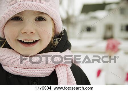 Close up of a little girl wearing a hat and scarf View Large Photo Image Picture - Close up of a little girl wearing a hat and scarf. Fotosearch