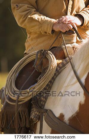 Stock Photo - Cowboy and lasso. Fotosearch