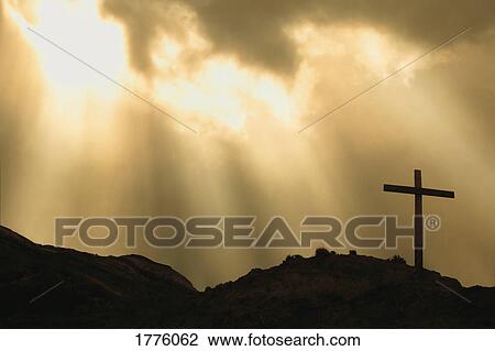 Stock Image - Cross on hill. Fotosearch