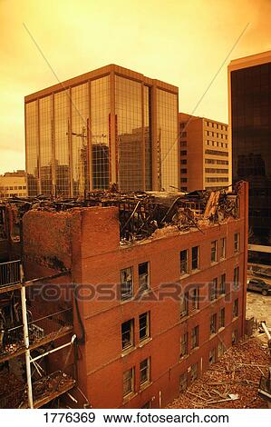 Stock Photo - Demolition of a burned building. Fotosearch