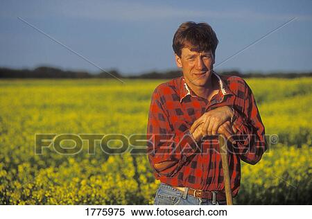 Stock Photography - Farmer working in field. Fotosearch