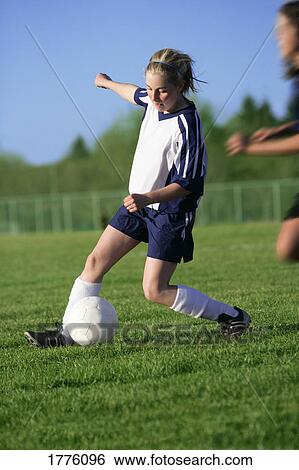 Girl playing soccer View Large Photo Image Stock Photograph - Girl playing soccer. Fotosearch
